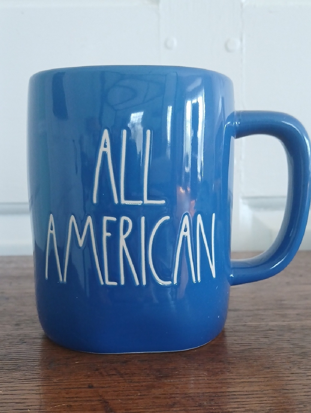 Rae Dunn "All American" Blue ceramic coffee mug.